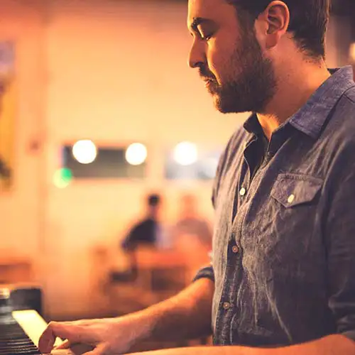 Aaron Guest playing the piano